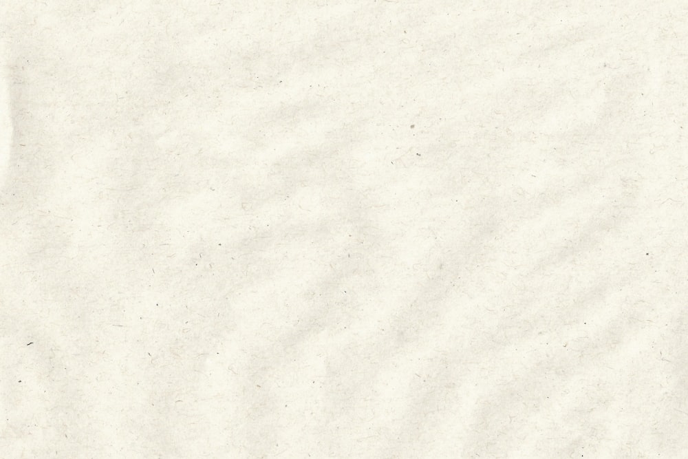 a close up of a white paper textured background