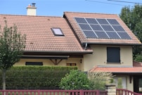 a house with a solar panel on the roof