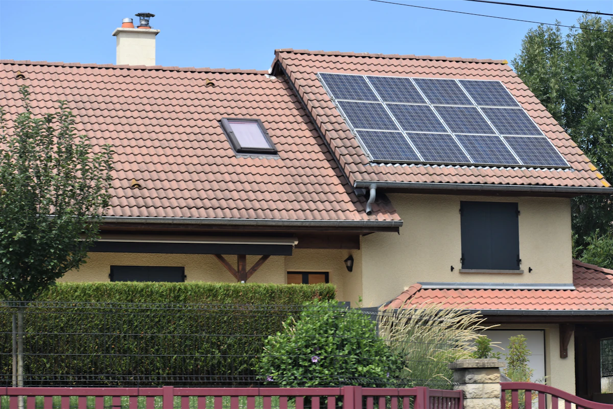 Modern red home with high-efficiency solar panels in Long Jetty
