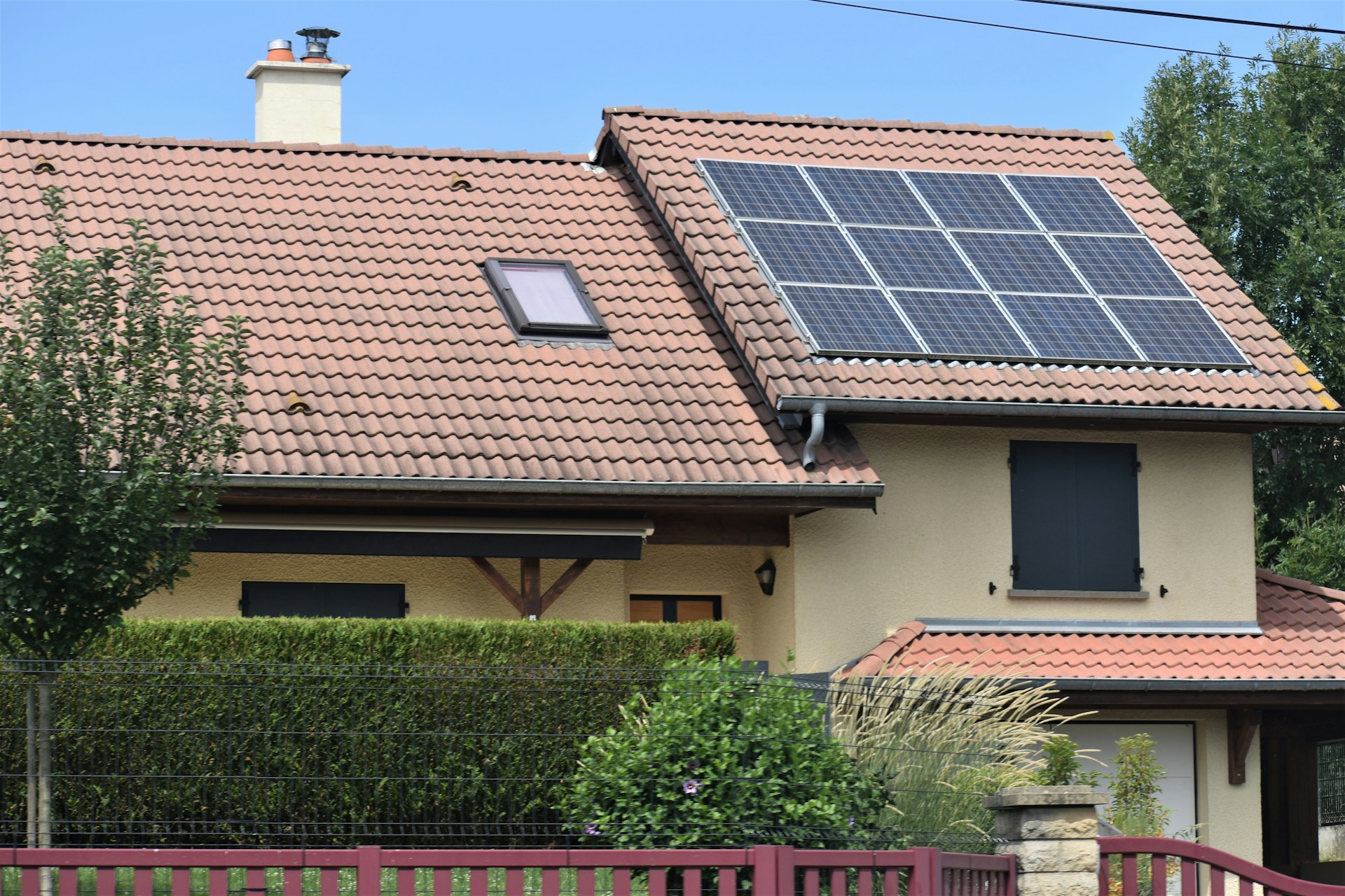 a house with a solar panel on the roof