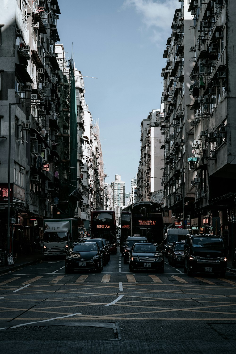 a city street filled with lots of tall buildings