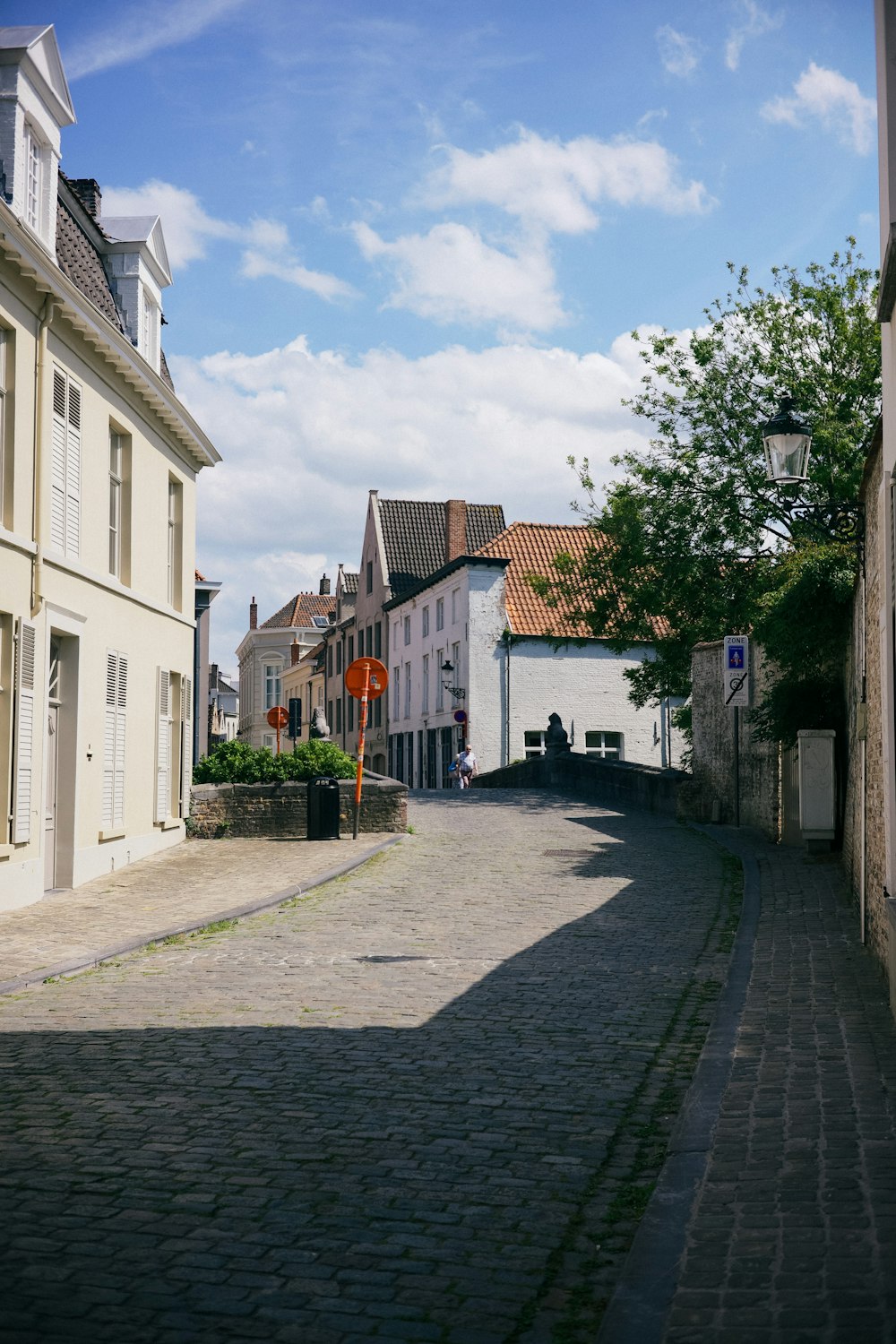 a cobblestone street in a small town