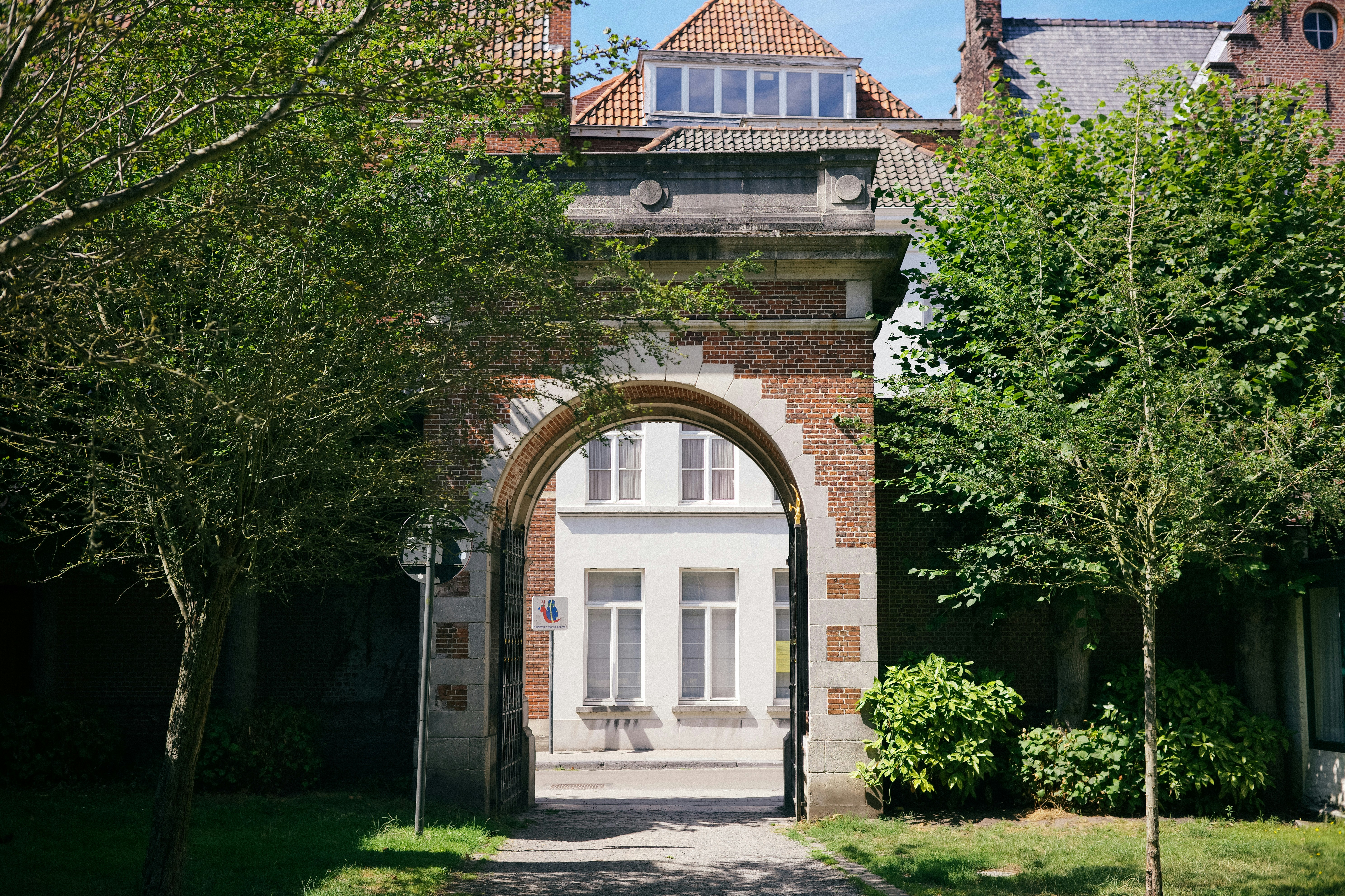 a large brick building with an arched doorway