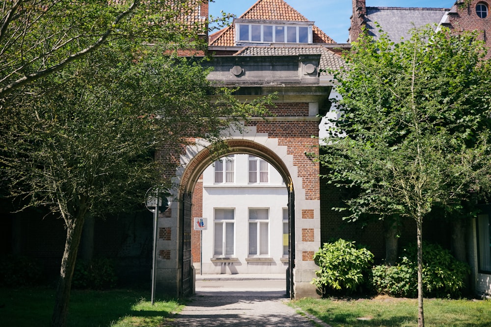 a large brick building with an arched doorway