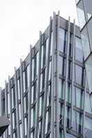 Modern container office with large windows and sleek metallic finishes.