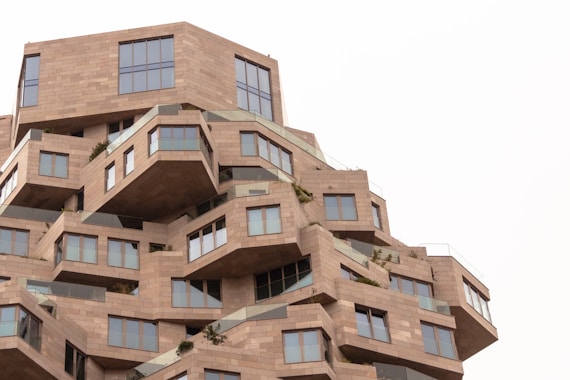 a very tall building with many windows and balconies