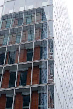 Luxurious commercial office space with glass facade and golden accents.