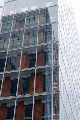 A modern office window installation showcasing sleek aluminum frames and clear glass panels