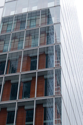 Modern commercial office space with glass facade and Jaipur-inspired decorative elements.