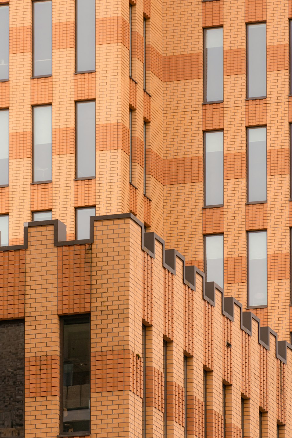 a tall brick building with lots of windows