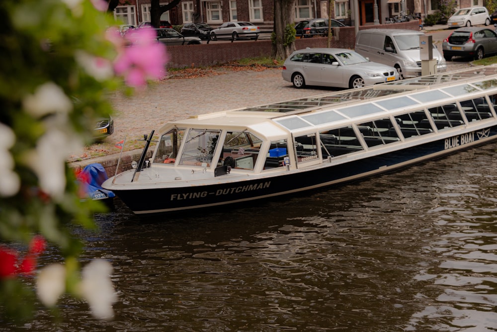 a boat is parked on the side of a river