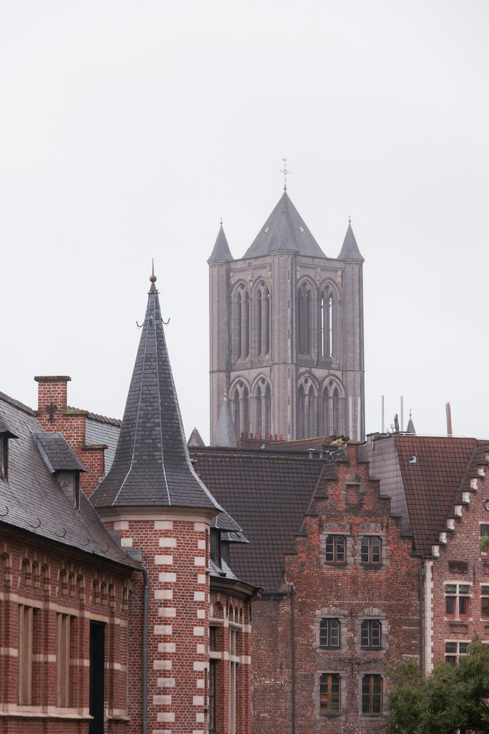 a large cathedral towering over a city filled with tall buildings