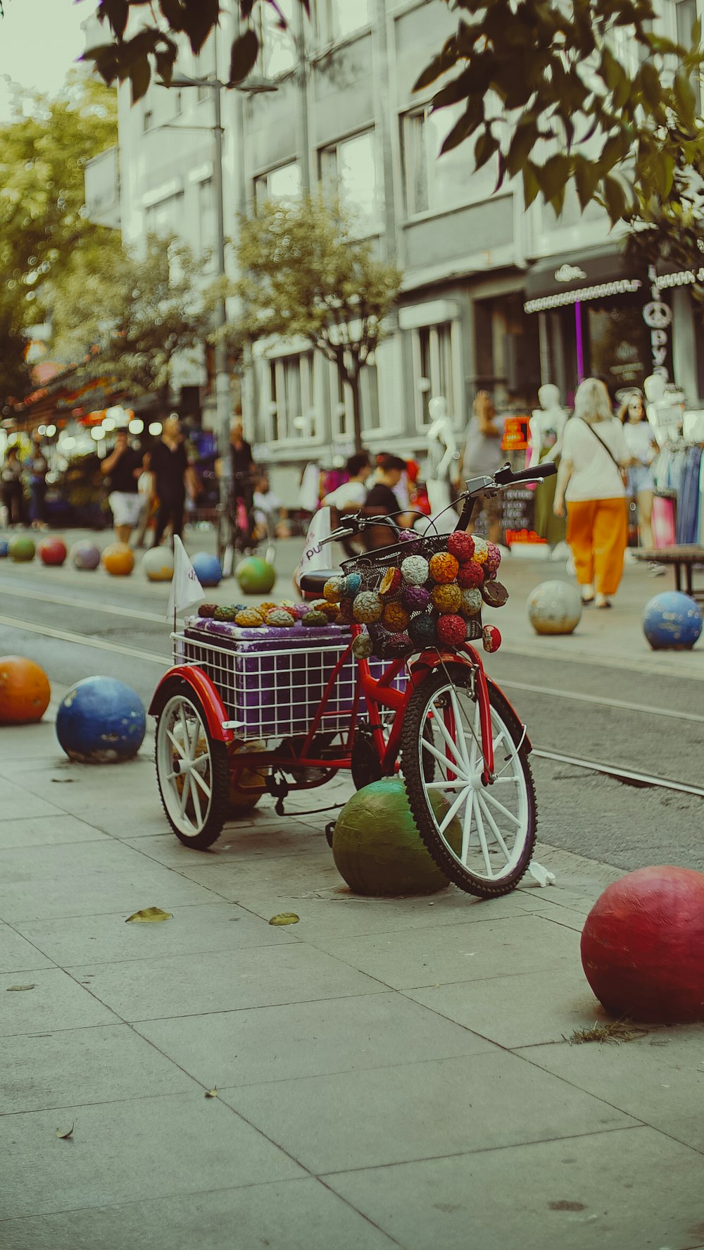 a bike with a basket full of fruit on the back of it