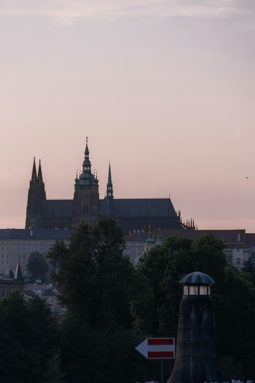 a city skyline with a clock tower in the distance