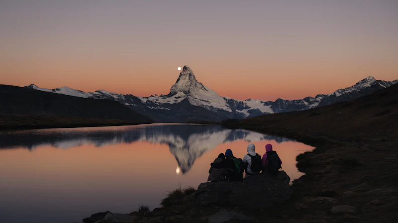 Sunrise over the Matterhorn reflected in a still lake near Zermatt