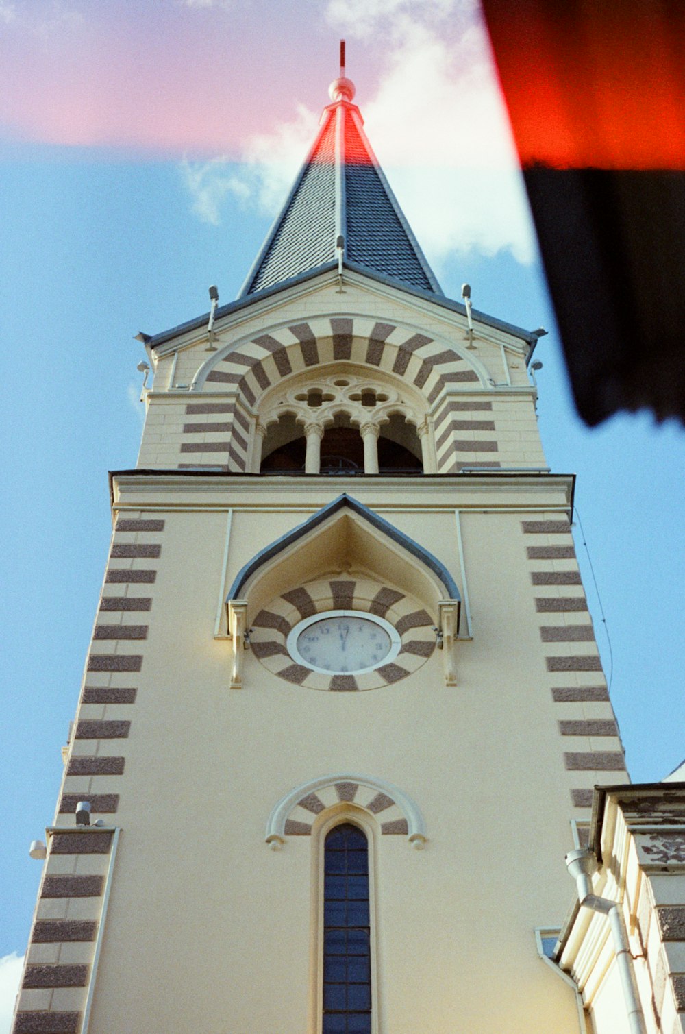 a tall building with a clock on the top of it