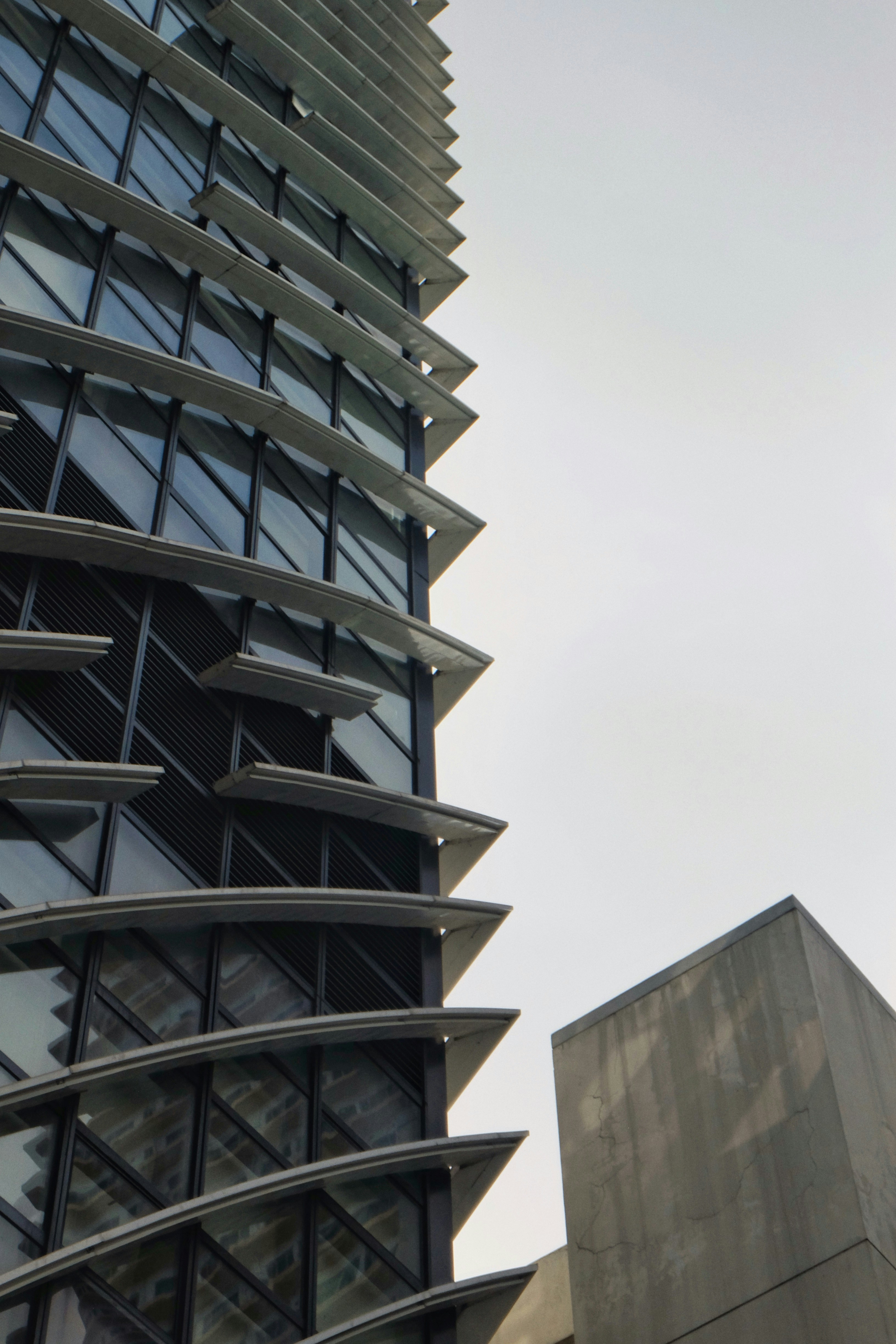 A very tall building with a clock on it's side photo – Free Building ...