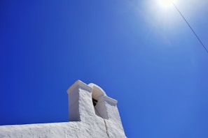 Wide shot of a freshly washed exterior wall gleaming under the Arizona sun