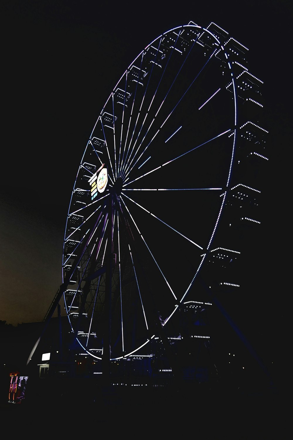 a large ferris wheel lit up at night