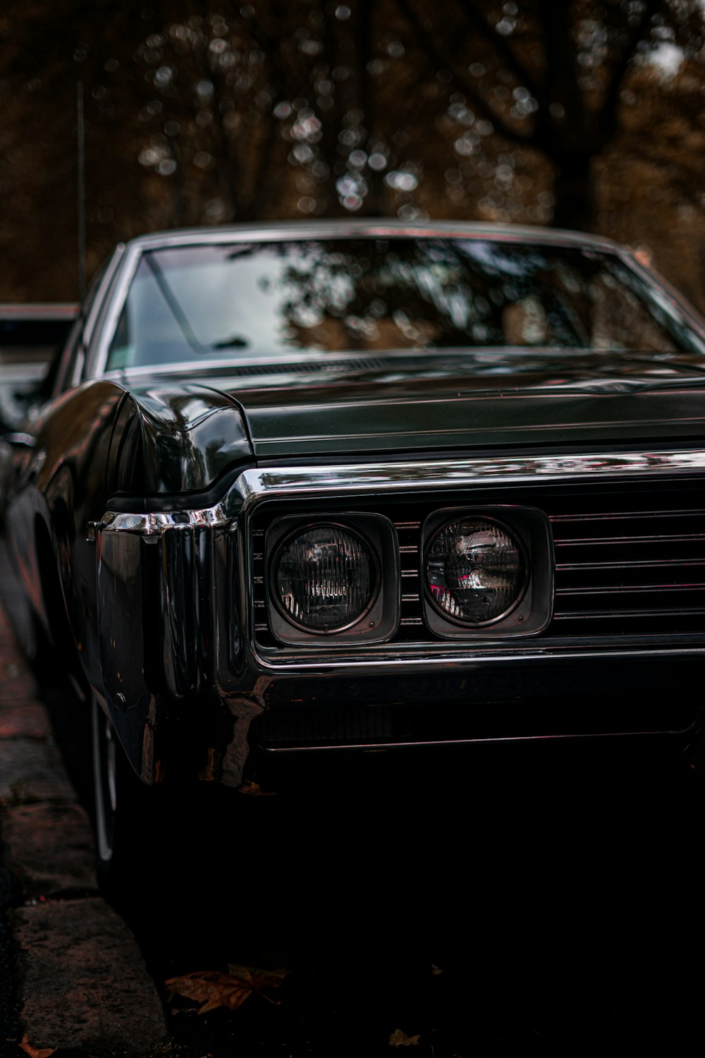 a black car parked on the side of the road