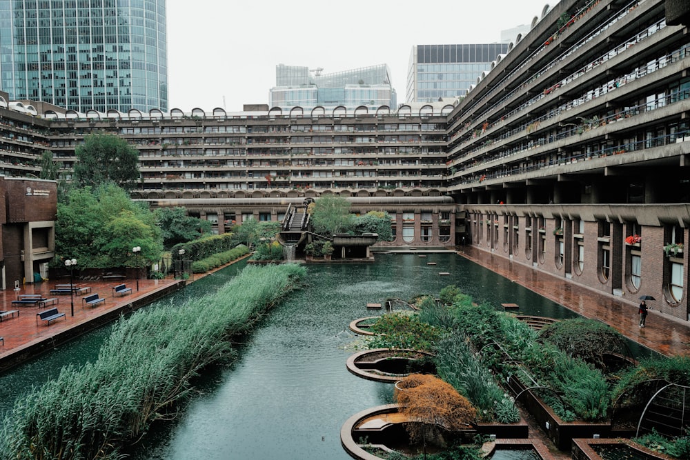 a river running through a city next to tall buildings