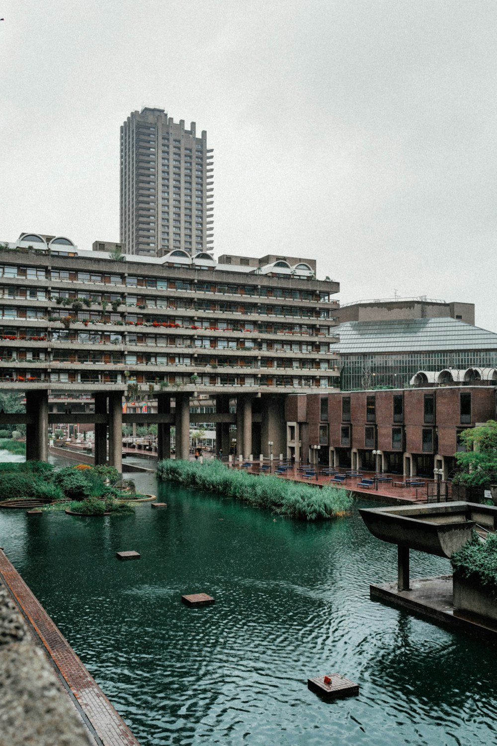 a river running through a city next to tall buildings