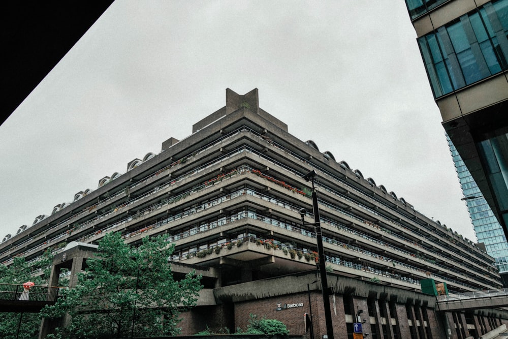 a very tall building sitting next to a tall building