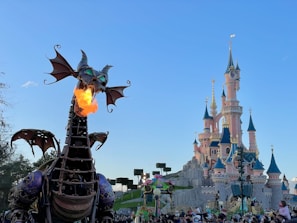 A lively scene from a storybook where a child is flying with friendly dragons over a sparkling castle.
