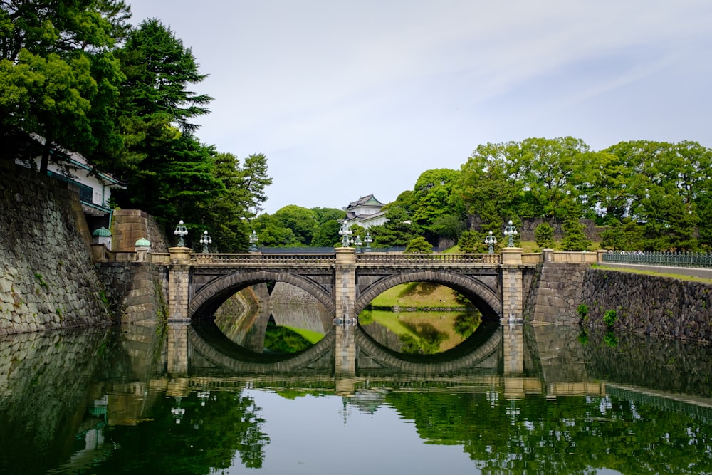 a stone bridge over a body of water