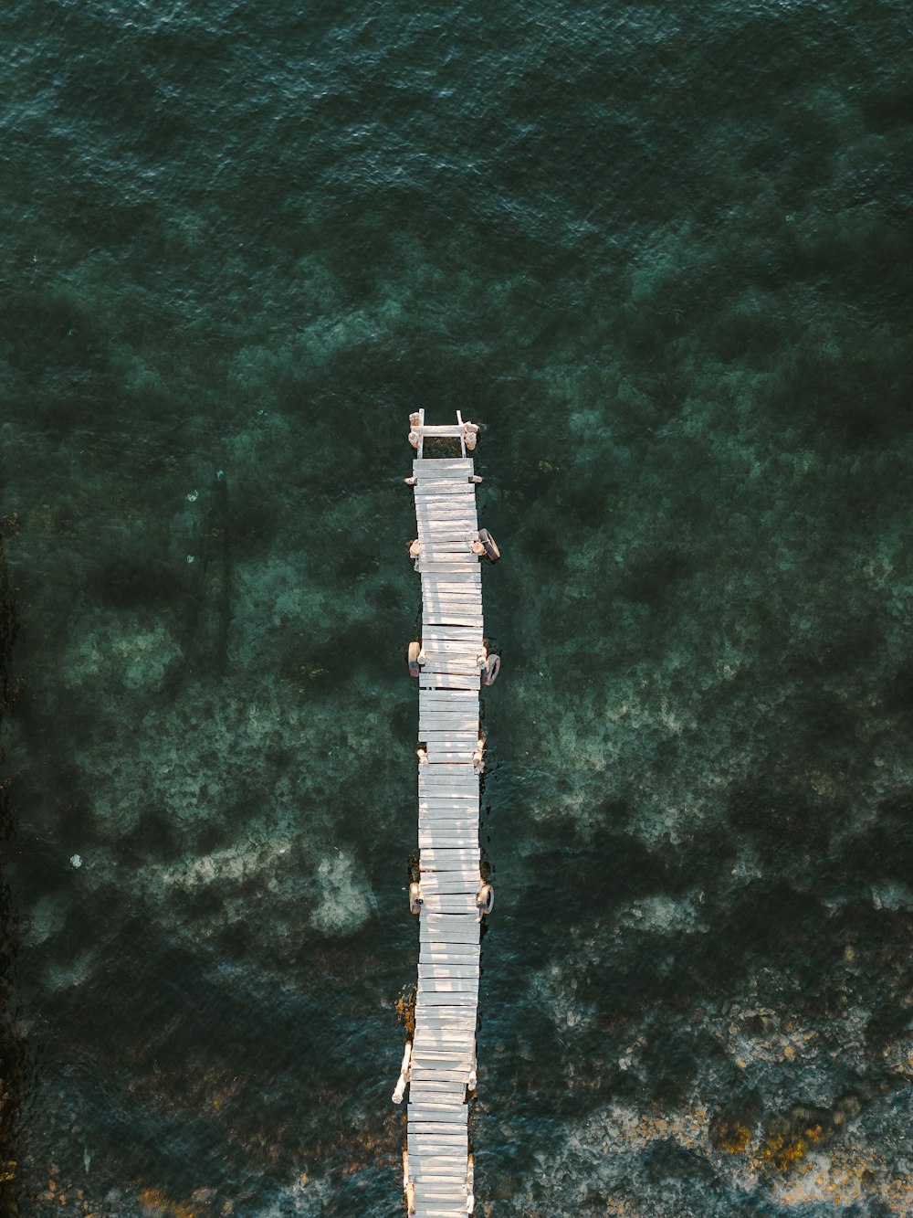 a long pier extending into a body of water