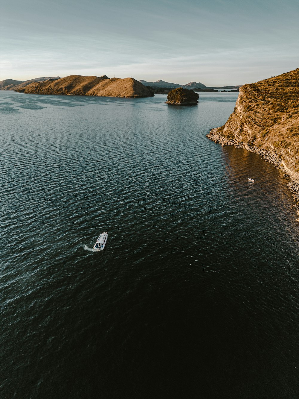 a boat floating on top of a large body of water