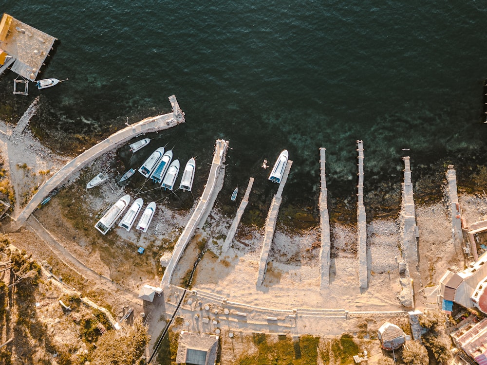 an aerial view of a dock with boats