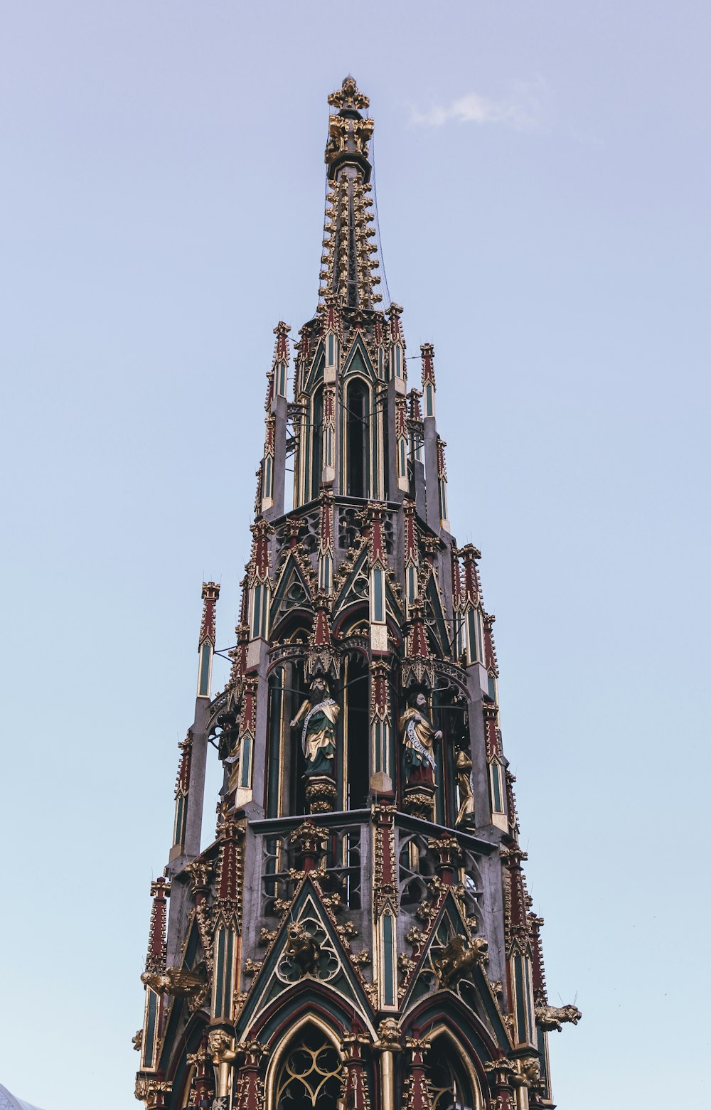 a very tall building with a clock on it's side