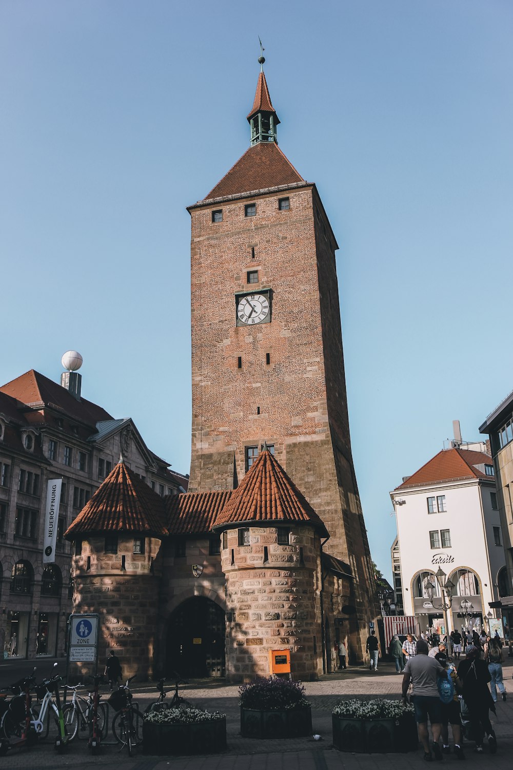 a tall brick tower with a clock on it's side