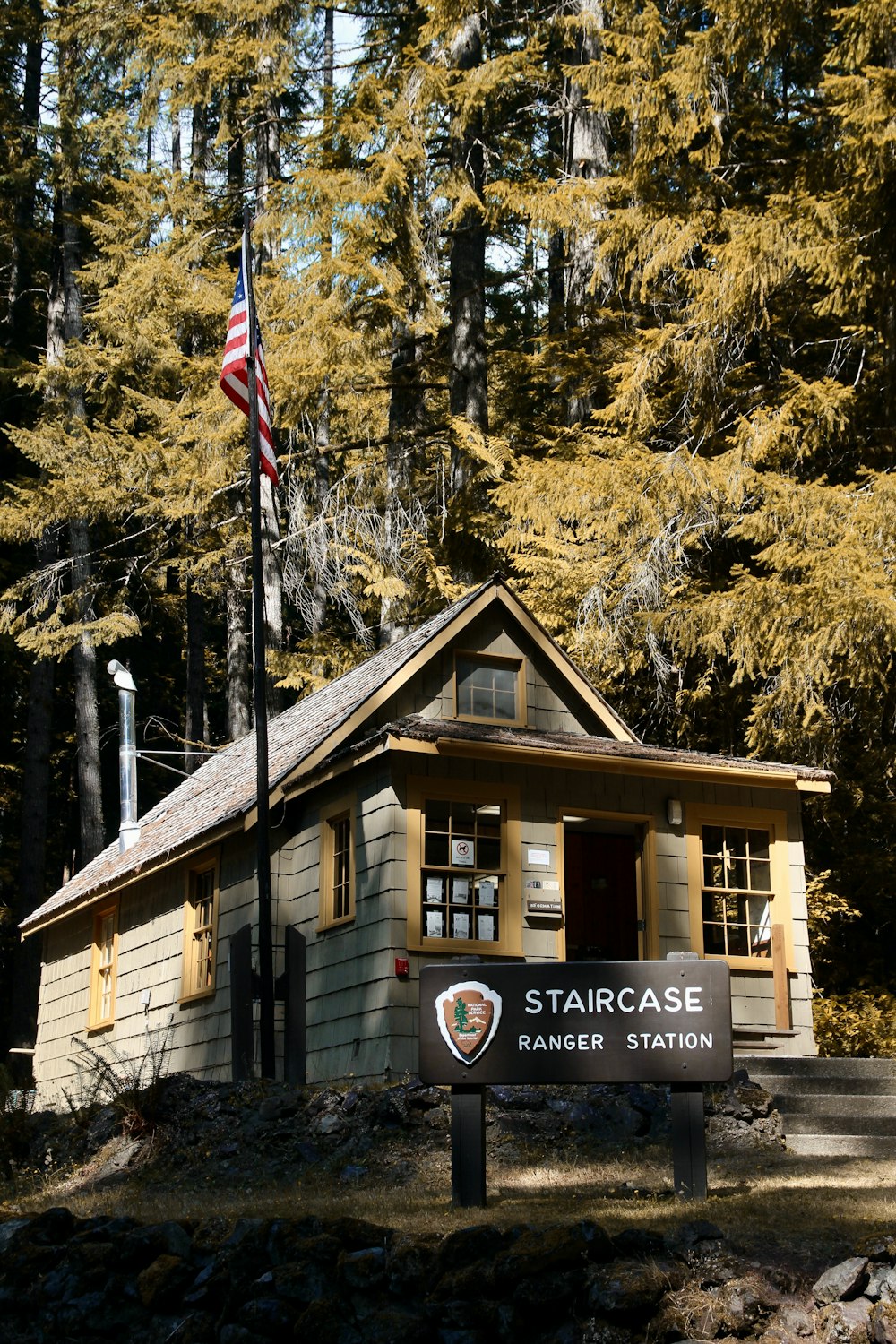 a small building with a flag on top of it