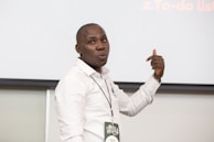 An instructor presenting in front of an interactive whiteboard.