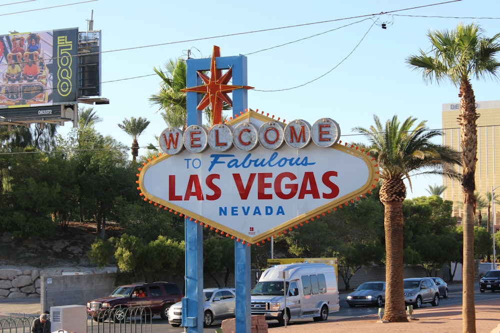 a welcome to fabulous las vegas sign on the side of the road