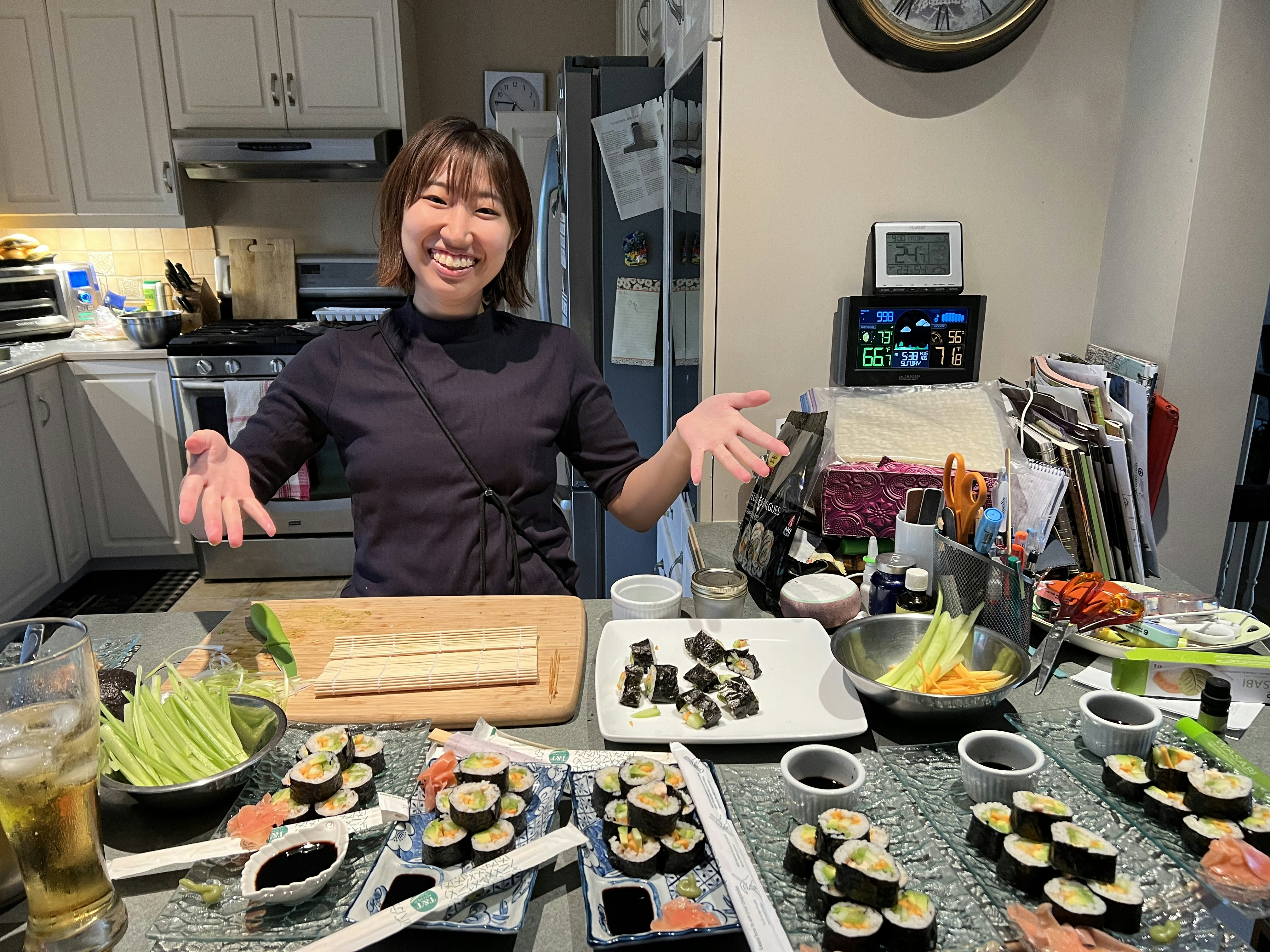 Japanese woman food creator smiling at camera in a clean minimalist kitchen