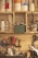A well-organized workshop wall with various tools and materials. The shelves contain jars and containers filled with supplies like paint and other materials. Below the shelves, there are hand tools including screwdrivers, pliers, and carving tools hanging on the wall. A pair of scissors is visible on the right side, and a basket holds pens and brushes.