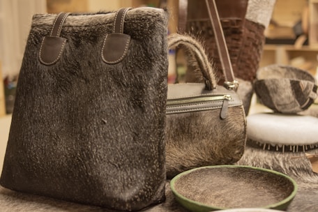a fur bag and other fur items on a table