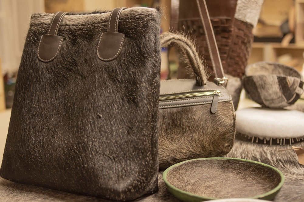 a fur bag and other fur items on a table
