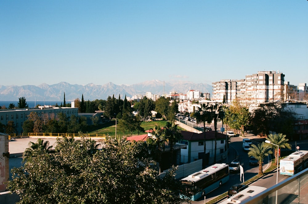 a view of a city with mountains in the background