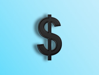 A black dollar sign symbol positioned against a light blue gradient background. The symbol casts a slight shadow, giving it a three-dimensional appearance.