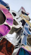 Close-up photo of a vibrant contemporary sculpture featuring bold shapes and textures.