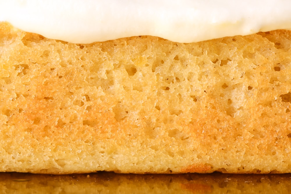 a close up of a piece of cake with icing