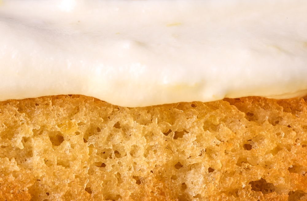 a close up of a piece of cake with icing