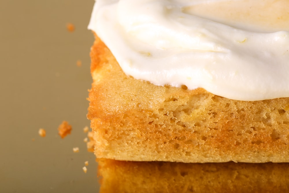 a close up of a piece of cake with icing