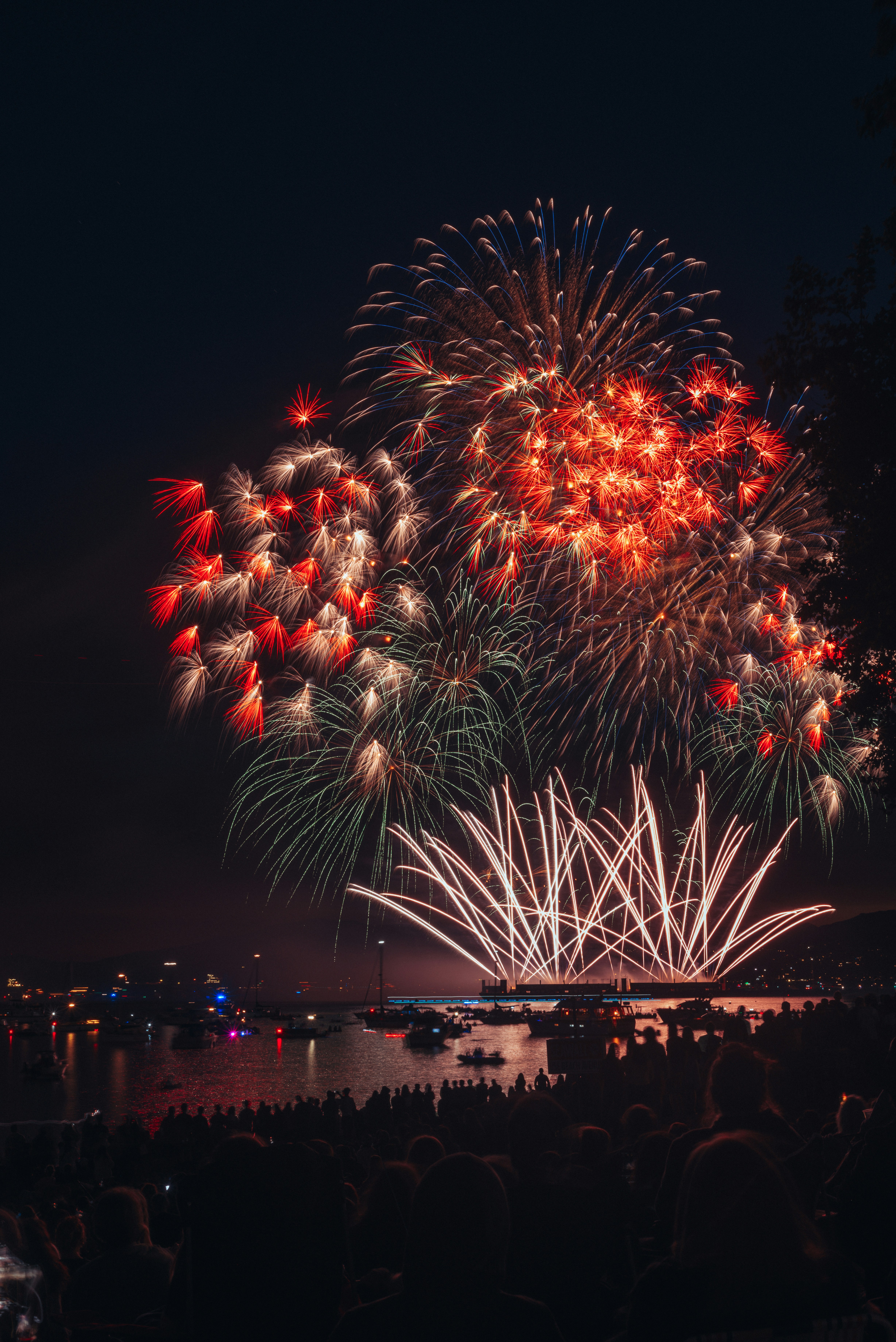 a large fireworks display over a body of water