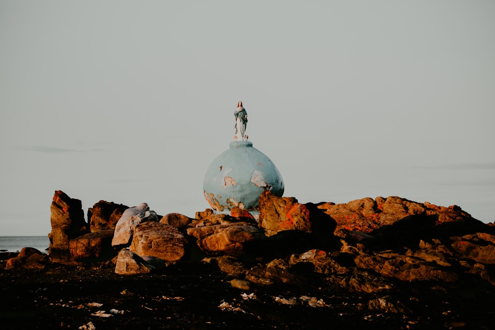 a person standing on top of a rock formation