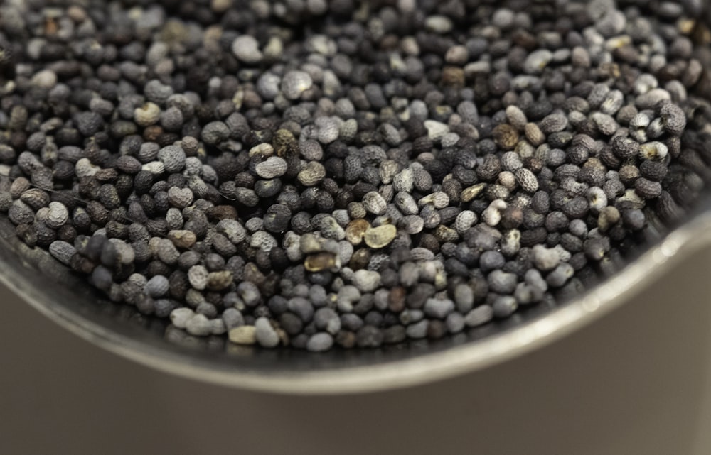 a close up of a pot filled with black beans